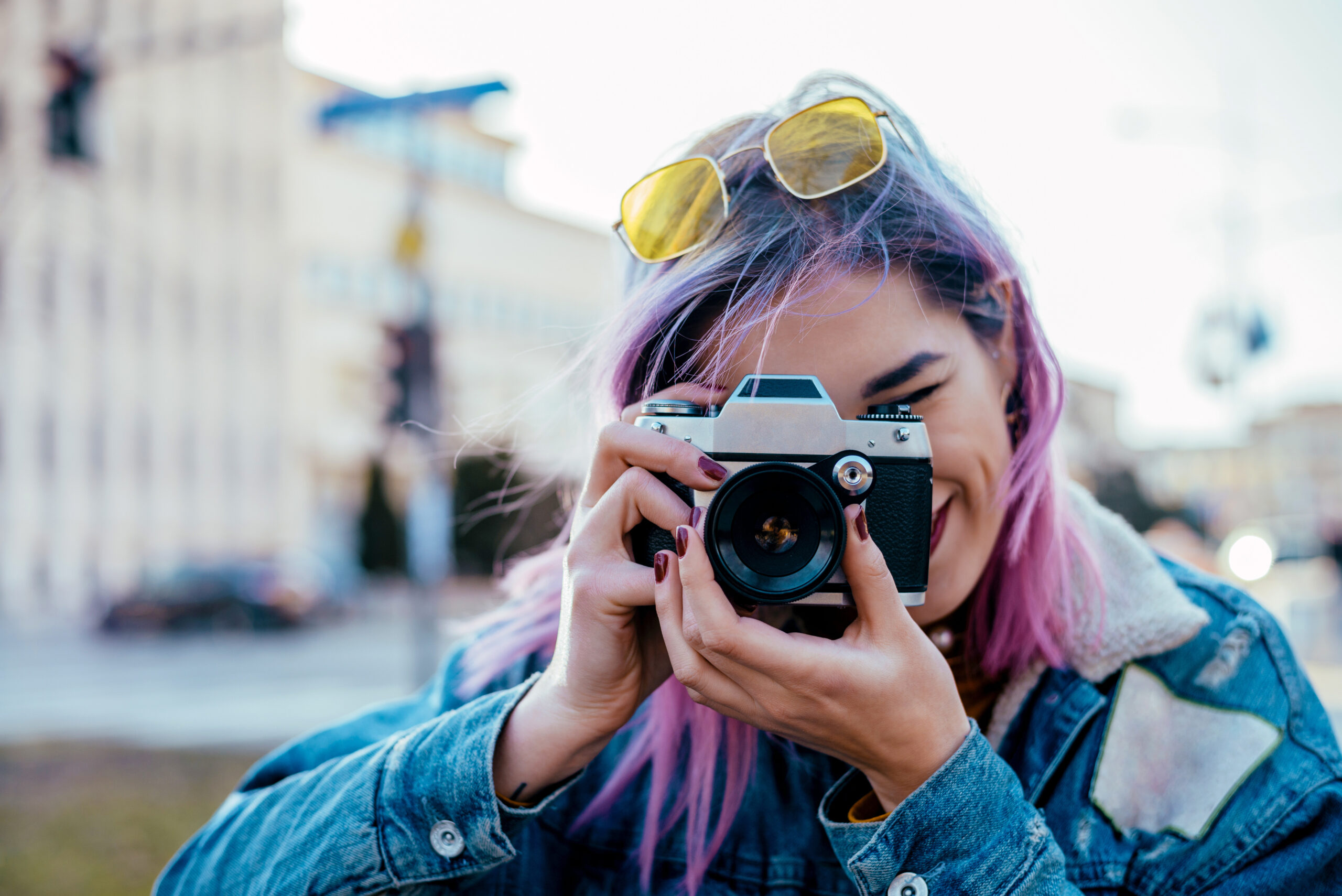 Community creator taking a photo with a camera