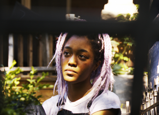 young teen girl deep in thought
