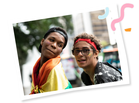 Young people at a Pride event with a flag